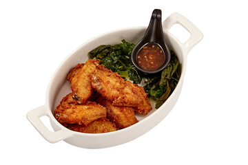 Crispy Fried Chicken wings with Crispy Basil Leaves and Chicken dipping sauce (sweet) isolated on white background. popular appetizers.