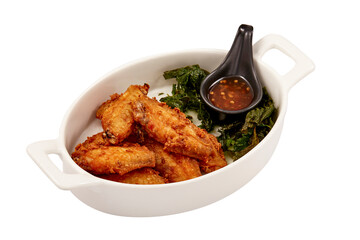 Crispy Fried Chicken wings with Crispy Basil Leaves and Chicken dipping sauce (sweet) isolated on white background. popular appetizers.