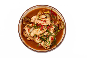 Top view of Thai Pork curry with Dill isolated on white background. That is local food of Isan in Thailand. This menu contains many vegetables such as dill, brinjal, chilli, lemongrass and red onions.