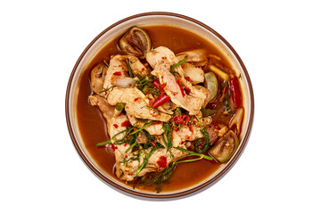 Top view of Thai Pork curry with Dill isolated on white background. That is local food of Isan in Thailand. This menu contains many vegetables such as dill, brinjal, chilli, lemongrass and red onions.