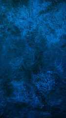 Deep blue texture or background with stains, waves and grain elements. Image with place for text. Template for design