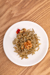 Stir-fried dried anchovies with walnuts