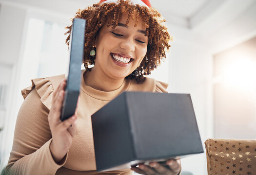 Christmas, Gift And Celebration With A Business Black Woman Opening A Box At An Office Party Or Event. December, Holiday And Present With A Female Employee Holding A Giftbox While Feeling Happy