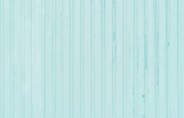 Obraz premium Light green background from paint on a smooth steel background.