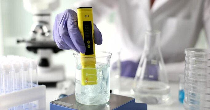 Scientist used chemical solution and lab test water quality or pH meter in lab