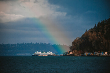 A colorful rainbow over Puget Sound and ferry