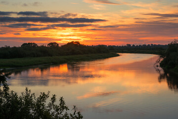 Fototapeta na wymiar The nature of Belarus - a calm summer landscape on the banks of the Berezina River