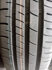 close up of car tire surface with vertical pattern.  suitable for background themes
