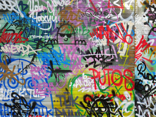 Fototapeta na wymiar Colorful graffiti on walls at the beach