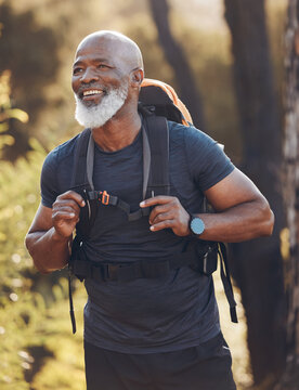 Senior black man hiking in nature for walking fitness, retirement wellness and carbon footprint travel journey in forest. Happy hiker or camper person trekking in woods with health journey and cardio