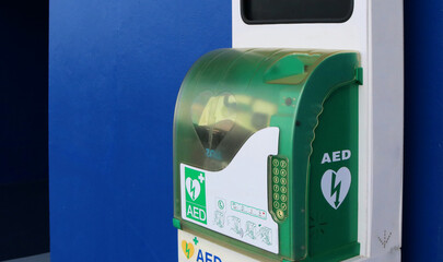 Automated external defibrillator or AED box in a public building for life saving.  - obrazy, fototapety, plakaty