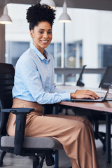 Black woman, business and portrait with a laptop in office while working and typing online. Young entrepreneur person writing an email or report for legal communication and advice on internet or web
