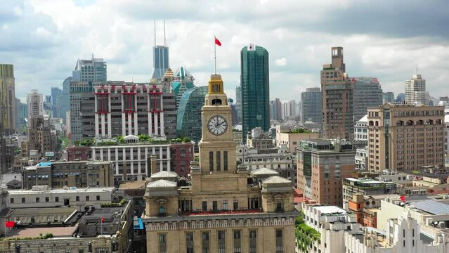 Aerial Panning Shot Of Clock On Custom House In Modern Residential City Under Cloudy Sky - Shanghai, China
