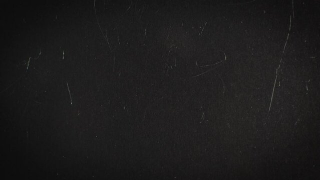 Scratches on glass on a dark background. Can be used as a background or overlay