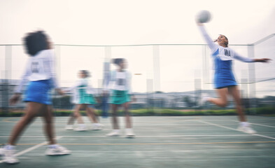Fototapeta premium Sports, netball and fitness jump by women at outdoor court for training, workout and practice. Exercise, students and girl team with ball for competition, speed and performance while active at field