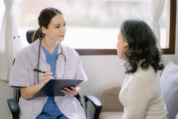 Concerned senior old patient patient talks with healthcare professional.