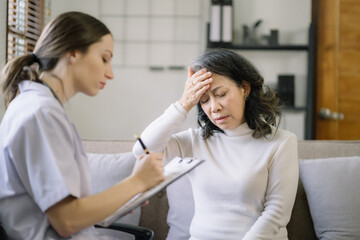 Concerned senior old patient patient talks with healthcare professional.