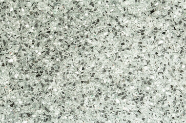 Abstract blurred background of small pebbles in white and gray