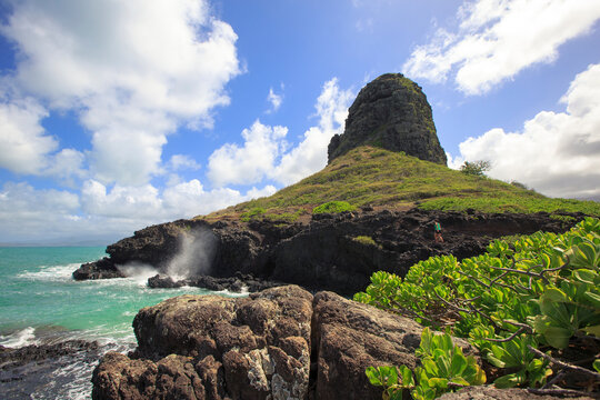 Hiker explores Mokoli&Ecirc;&raquo;i Island also known as Chinaman&acirc;&euro;&trade;s Hat off the shore of Oahu, Hawaii.