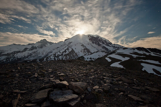 The Moon rises over Mount Ranier.