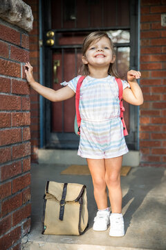 Excited young girl leaving for preschool