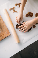 Obraz na płótnie Canvas child preparing gingerbread. girl child is preparing Christmas sweets