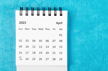 The April 2023 Monthly desk calendar for 2023 year on blue colour background.