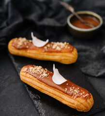 Traditional french dessert. eclair with caramel