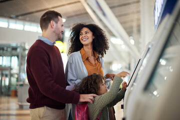 Self service, travel and interracial with family in airport for check in, vacation and global....