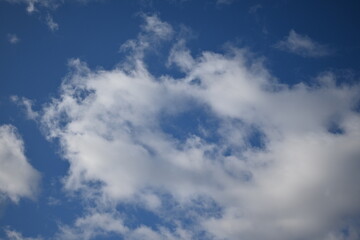 spring white clouds against the blue sky background summer cloudy sky