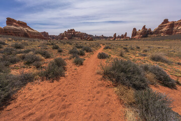 hiking the chesler park loop trail in the needles in canyonlands national park, usa