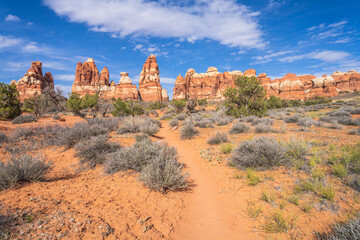 hiking the chesler park loop trail in the needles in canyonlands national park, usa