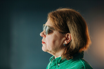 elderly woman wearing special glasses for eye training