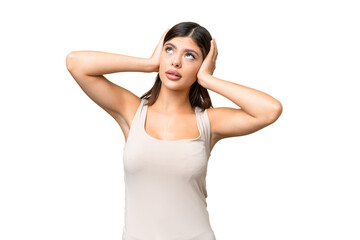 Young Russian woman over isolated chroma key background frustrated and covering ears