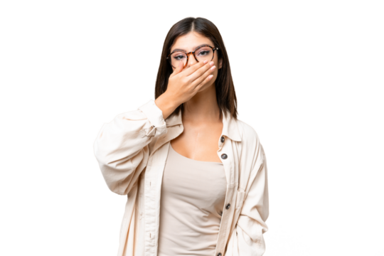 Young Russian woman over isolated chroma key background covering mouth with hand