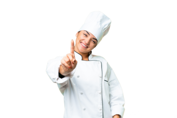 Young woman Chef over isolated chroma key background showing and lifting a finger