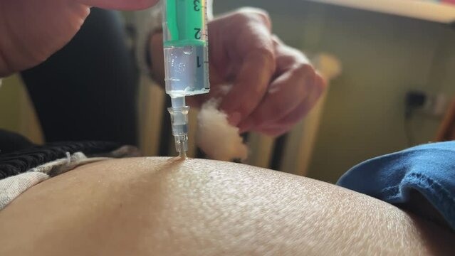 Intramuscular injection of a syringe. The concept of medicine. Close-up