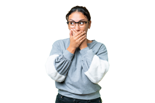 Young Uruguayan woman over isolated chroma key background covering mouth and looking to the side