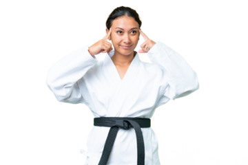 Young Uruguayan woman doing karate over isolated chroma key background having doubts and thinking