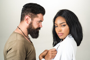 Sensual ethnic, couple in tender passion. Beautiful sensual afro american, african woman and sexy man. Sensual couple in love. Sexy young lovers. Studio portrait of young couple.