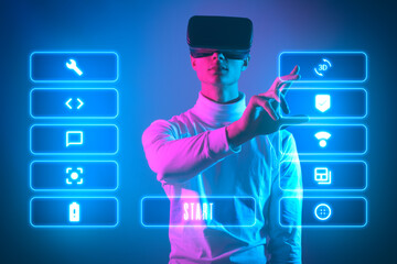 man with vr glasses is in virtual life and look up to virtual dashboard with options and icons to...