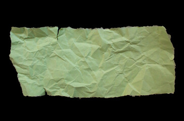 Crumpled yellow paper piece isolated on a black background. Wrinkled paper sheet.
