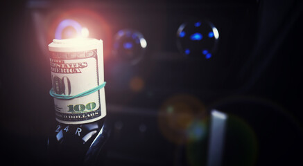 Concept background. dollars with a car key lie in inside cars. financial concept