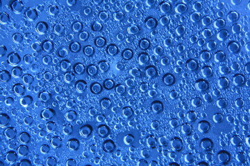 drops of water on blue plastic