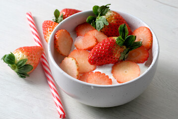 White bowl with yogurt and strawberries - Powered by Adobe