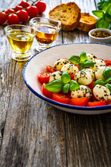 Caprese salad on wooden board
