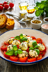 Caprese salad on wooden board
