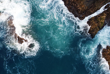 Aerial view of the sea rocks cliffs in the ocean. Beautiful sea wallpaper for tourism and advertising. Stormy landscape, drone photo © Payllik