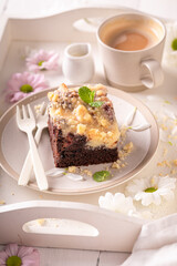 Homemade yeast cake served with coffee in porcelain..