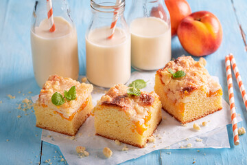 Delicious peach cake with glaze. Served with milk.
